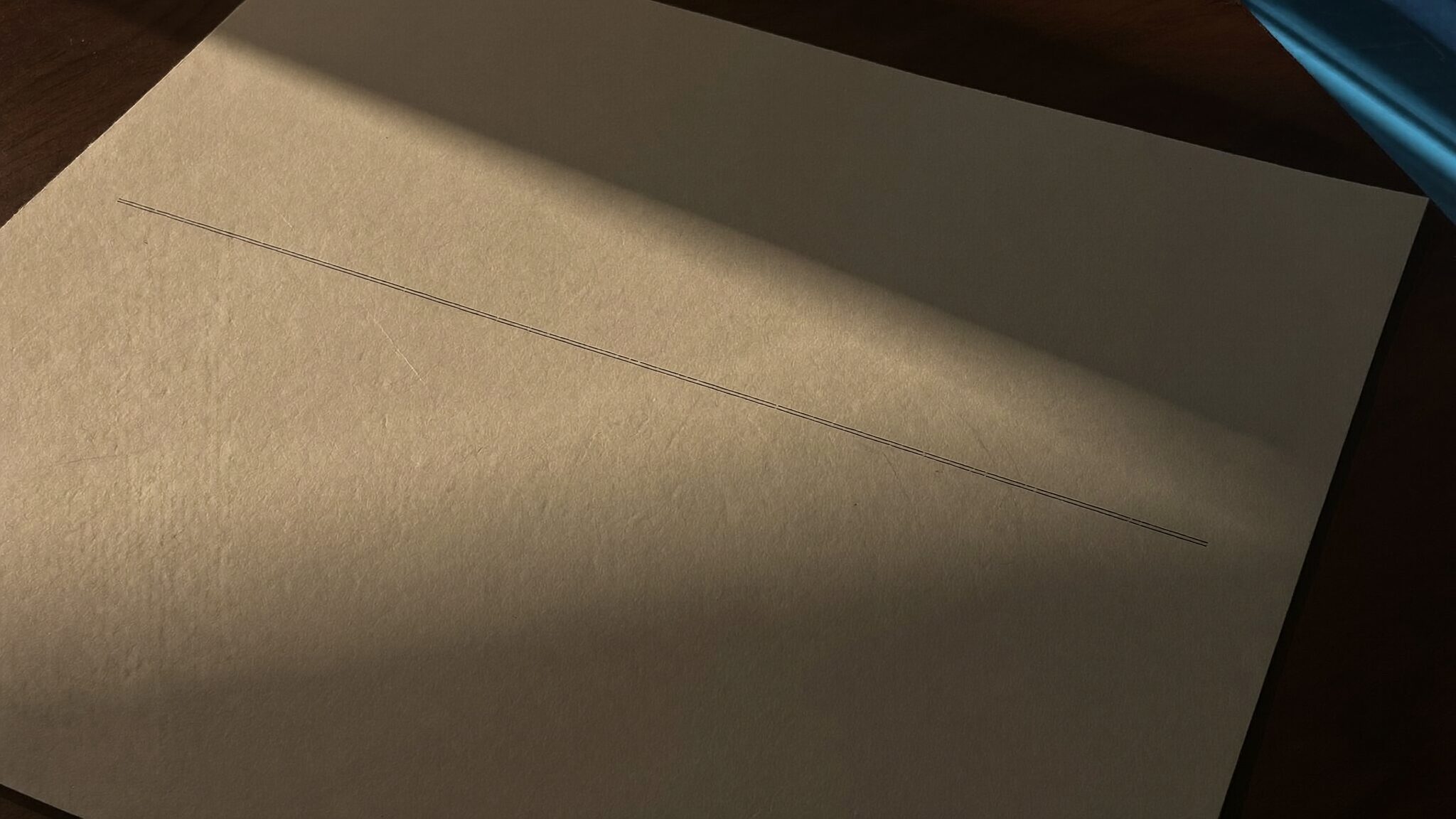 A single empty ruled signature line on cream paper