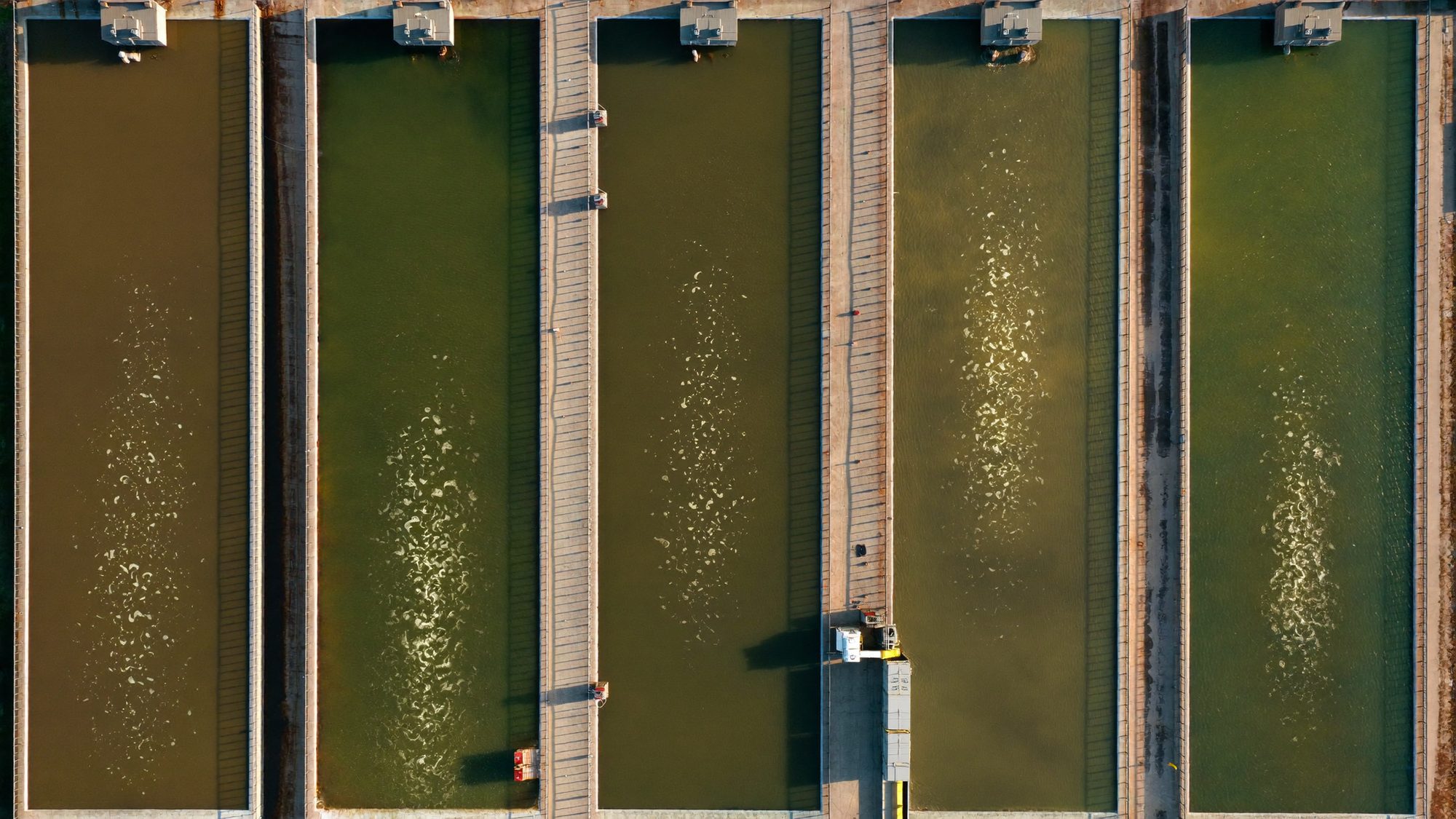 Aeration basins at a wastewater treatment plant with surface agitation